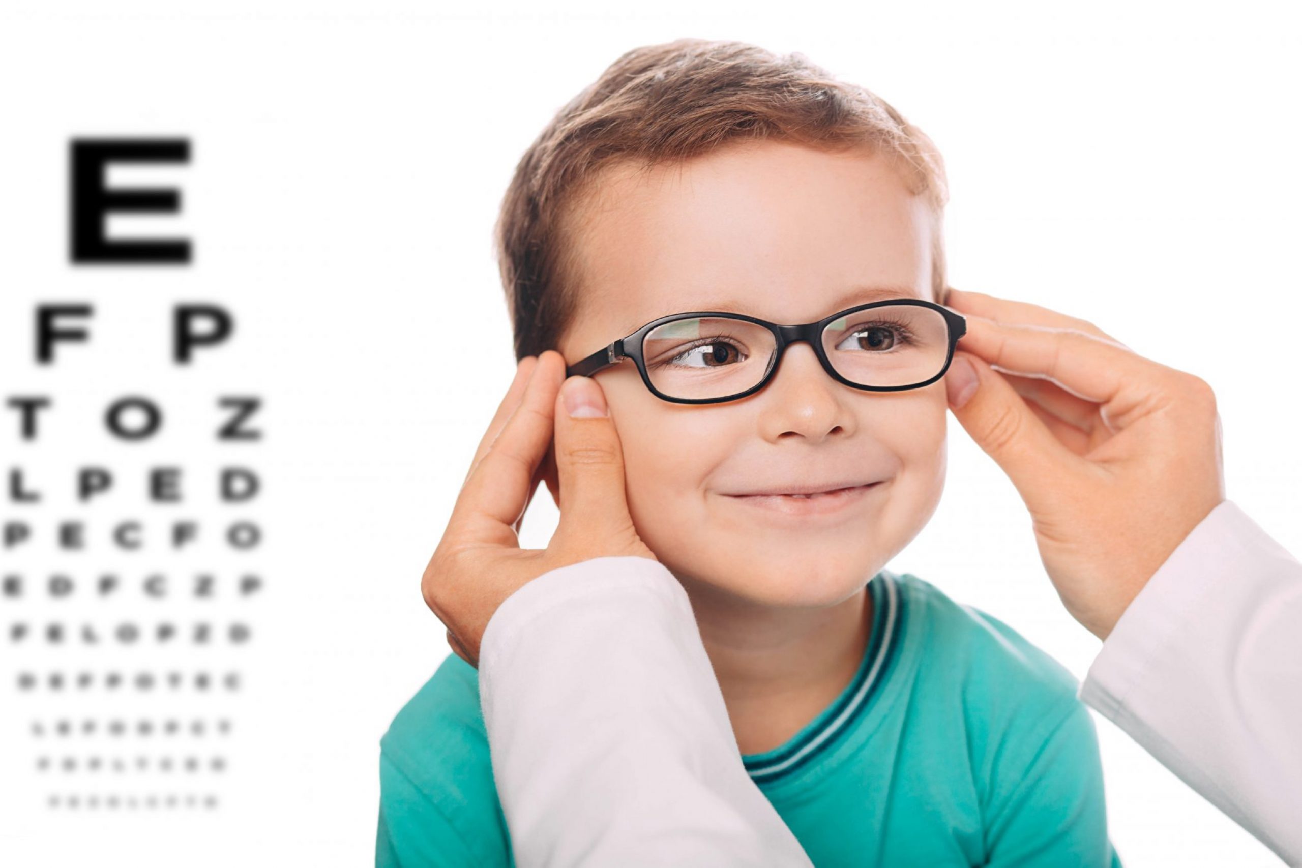 Little,Boy,Testing,New,Eyeglasses,,Optician,Is,Adjusting,New,Frame